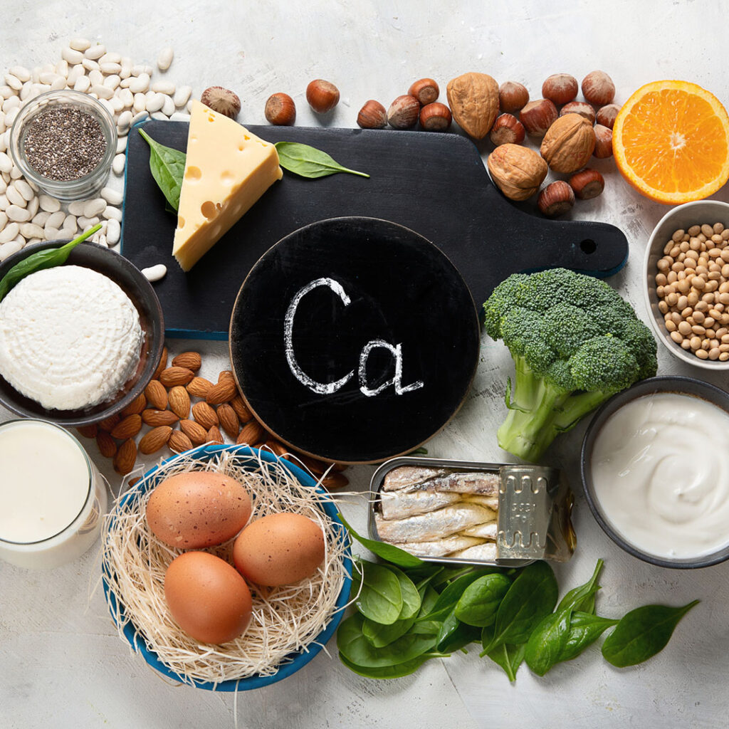 Foods high in calcium displayed on a light gray background.
