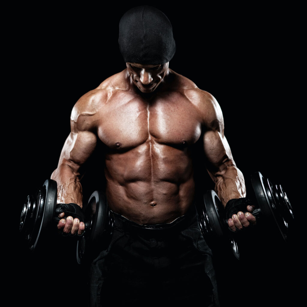 Picture of muscular man doing a bicep curl with dumbbells