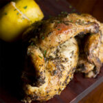 Split Cornish Came Hens seasoned with herbs and lemon